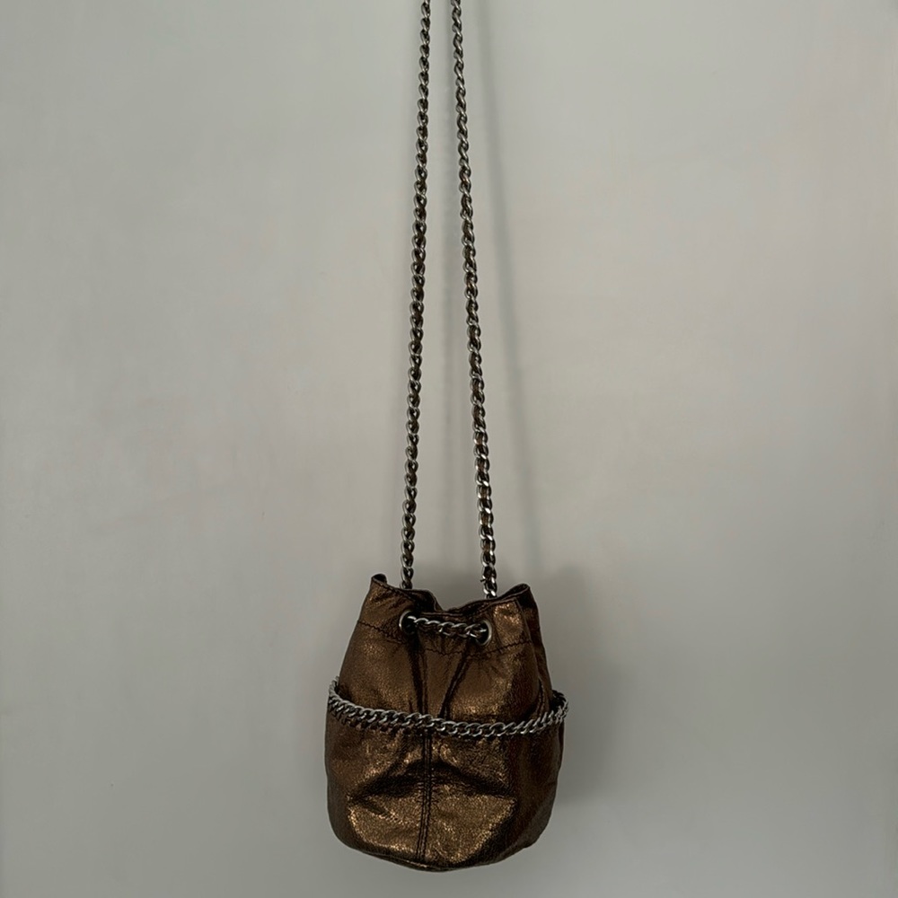 A bronze metallic material shoulder bag.